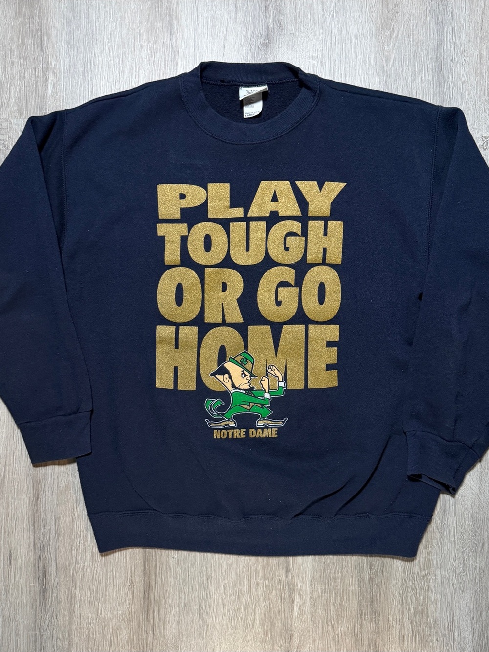 NCAA Navy Crewneck with Gold Slogan and Green Notre Dame Mascot